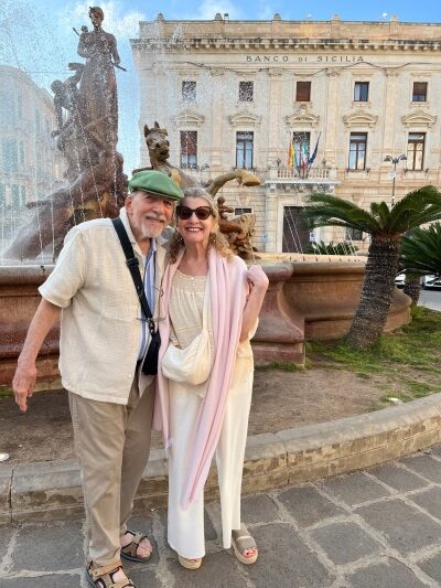 The author is seen here with her father in Sicily