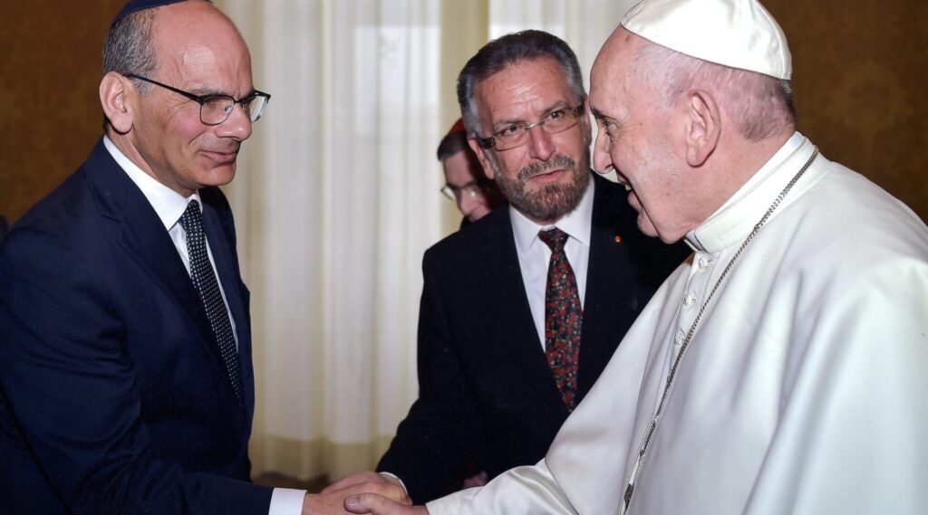 Rabbi Noam Marans (left) shakes hands with Pope Francis