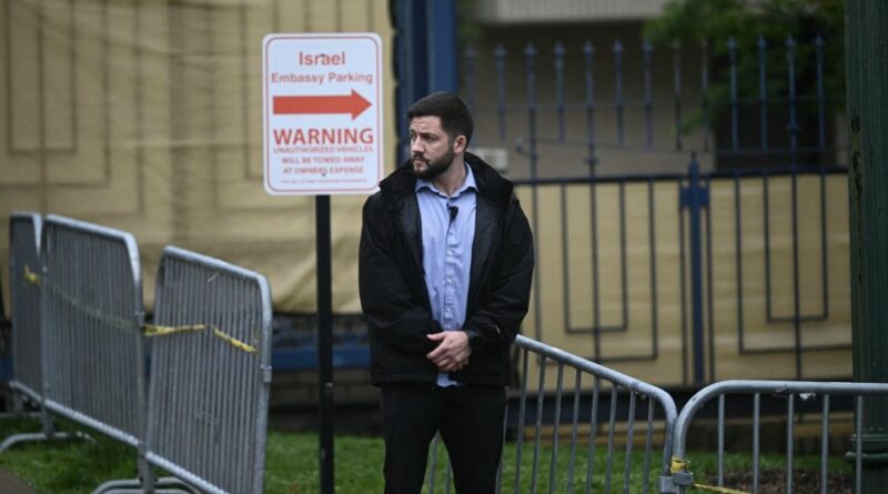 Security officers surround the Israeli Embassy in Washington, DC