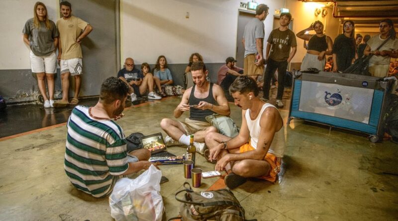 Israelis take shelter in a public underground facility