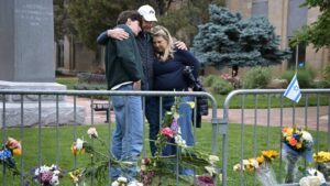 Isaac Dechtman of Denver and his parents Evan and Jennifer comfort each other at the Boulder County Courthouse on Pearl Street in Boulder, Colorado, on June 3, 2025, two days after 12 people marching to raise awareness for Israeli hostages in Gaza were injured in a "targeted act of violence" by a man wielding incendiary devices.