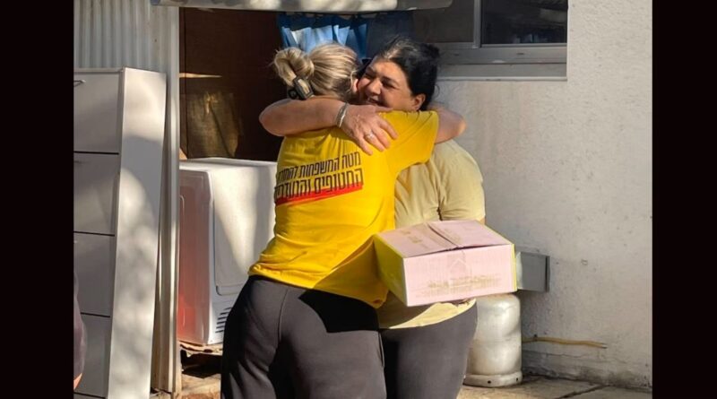 A kibbutz member receives her homecoming kit