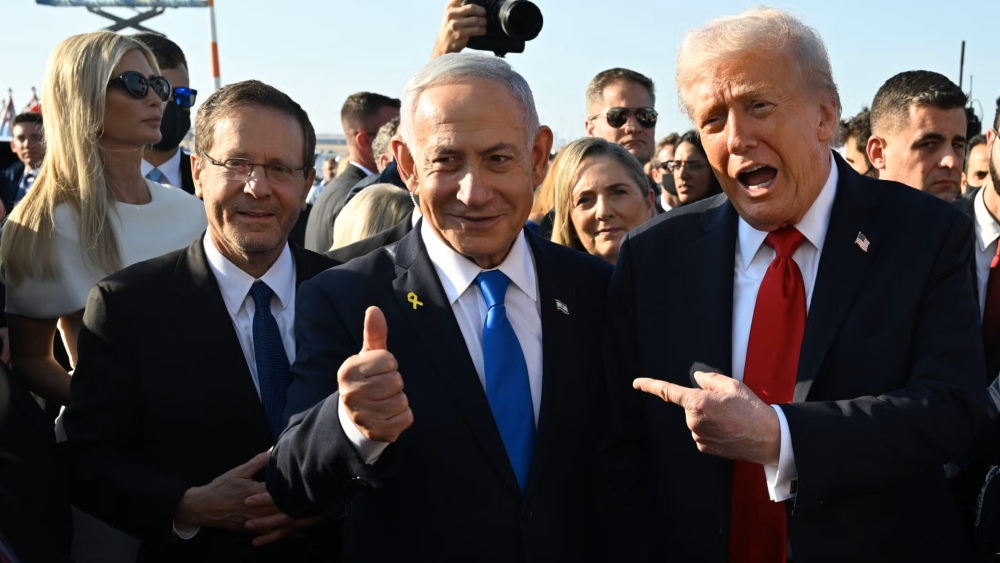Israeli Prime Minister Benjamin Netanyahu is shown flanked by Israeli President Isaac "Bougie" Herzog (left) and U.S. President Donald Trump in Tel Aviv last year.