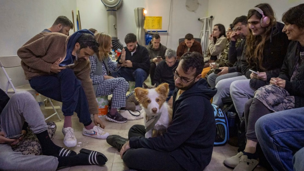 Israelis take cover in a public shelter